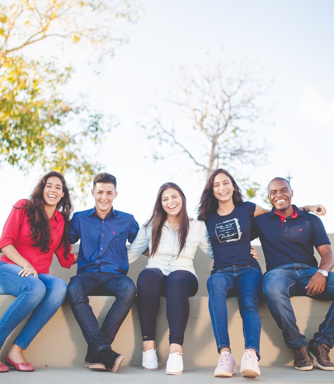 A group of students sitting and smiling